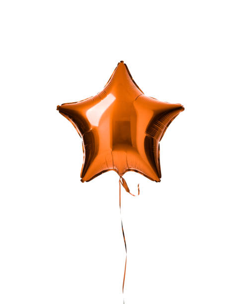 istock Single light orange color metallic star balloon object for birthday party isolated on a white 939850936