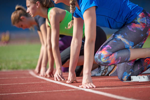 istock Women ready to race on track field 939851120