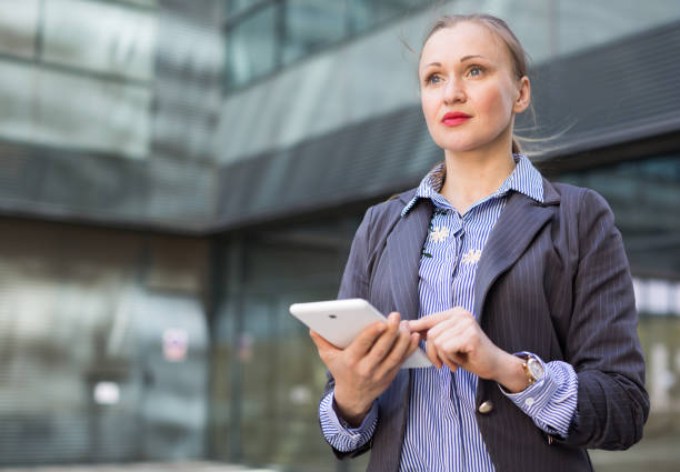 istock Female testing digital tablet in the modern city 939851302