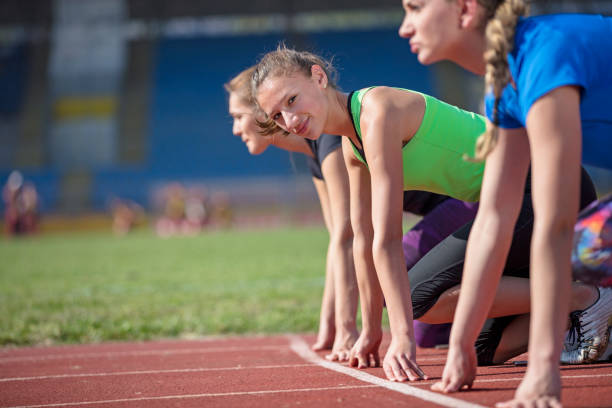 istock Women ready to race on track field 939851538