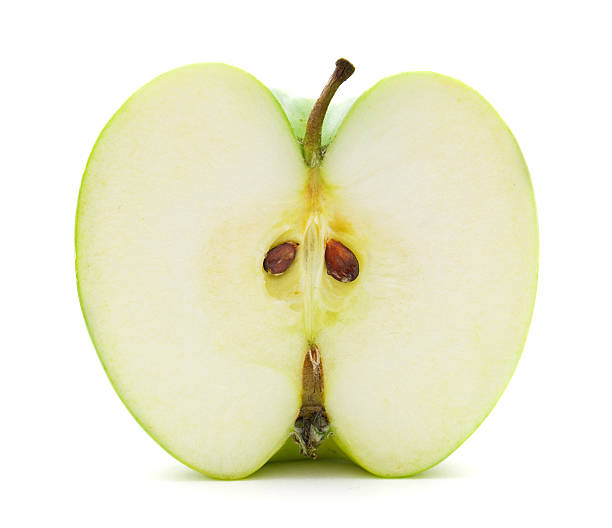 istock Green apple sliced in half isolated on white background 93985230