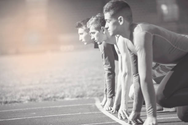 istock Athletes at the sprint start line in track and field 939855498