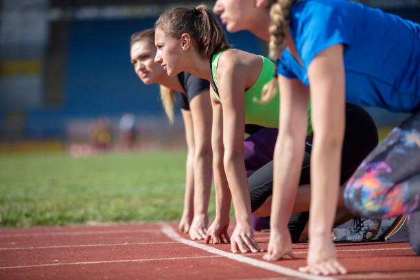 istock Women ready to race on track field 939855514