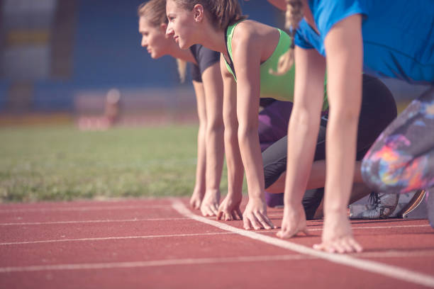 istock Women ready to race on track field 939855530