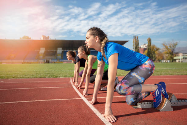 istock Women ready to race on track field 939856196