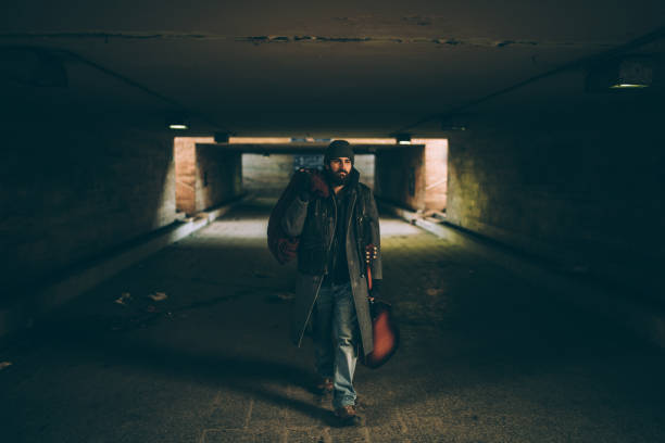 istock Street performer walking in subway 939858970