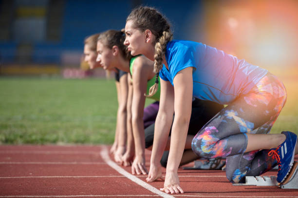 istock Women ready to race on track field 939859004