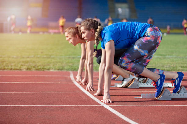 istock Women ready to race on track field 939859228