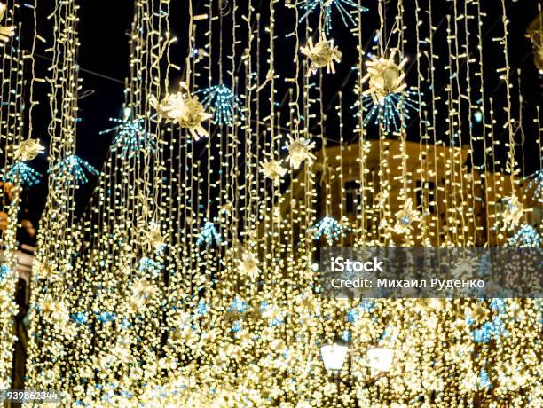 Night City Garland Hanging Outside In The Street Stock Photo - Download Image Now - Abstract, Advent, Alley