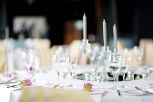 istock Beautiful table setting with crockery and flowers for a party, wedding reception or other festive event 939870800