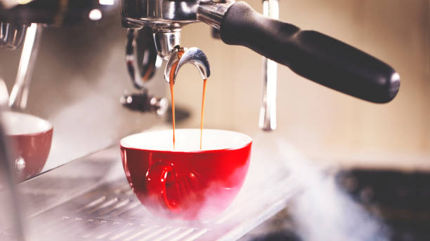 Pulling A Shot of Espresso Pulling A Shot of Espresso espresso maker stock pictures, royalty-free photos & images