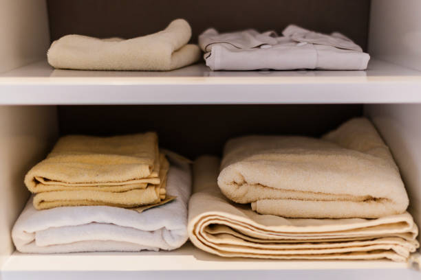 istock towel cloth in shelf for choice in white cabinet 939884706