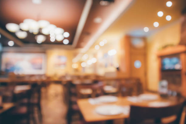 istock Restaurant cafe or coffee shop interior with people abstract defocused blur background 939886864