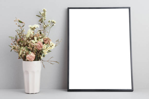 istock Poster frame mock up and bunch of flowers 939886988