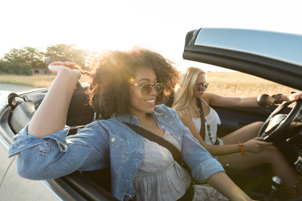 istock Young women having fun on road trip 939890962