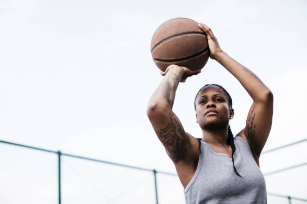 istock Girl shooting hoops 939891140