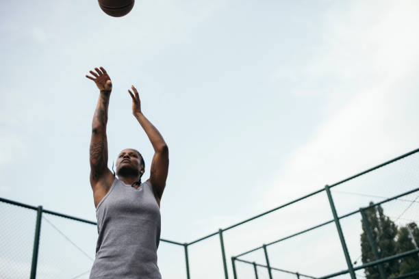 istock Girl shooting hoops 939891196