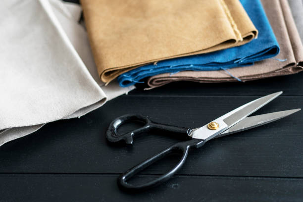 istock Tailor scissors and cotton clothing 939892076