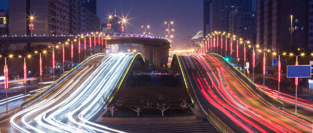 istock City night view Car taillight trajectory 939895364