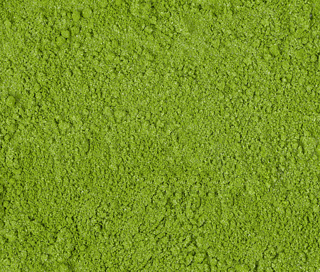 Background of green powder, border surface close up of powdered green tea