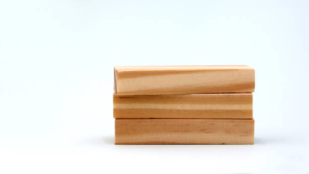 istock A pile of three wooden blocks on a bright background. 939910954