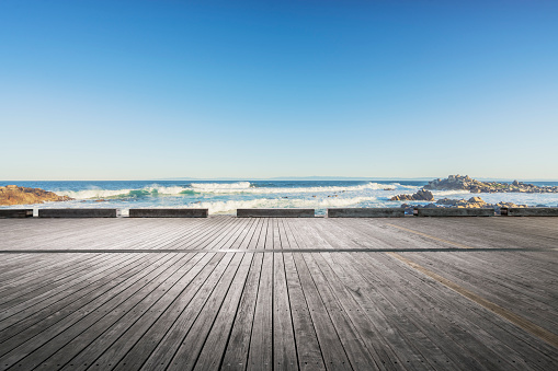 scenic view of seascape against sky,empty wooden plank on foreground.