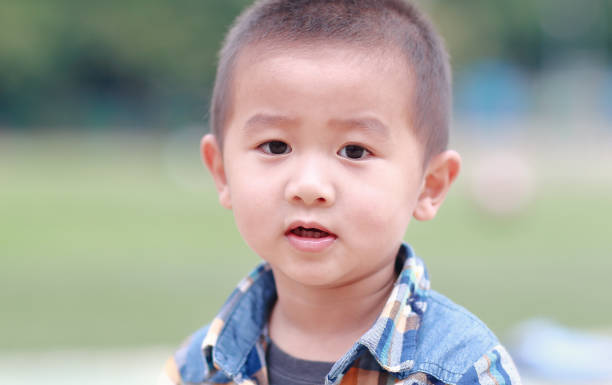 istock Cute children playing in the park 939918490