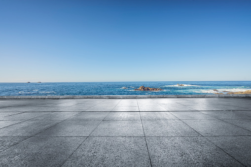 scenic view of seascape against sky,empty tiled floor on foreground.
