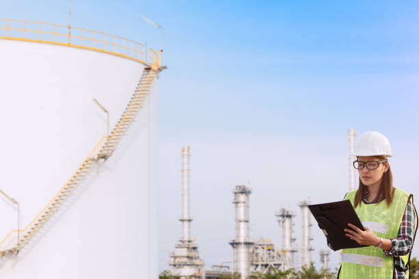 istock Architects team on construction,oil refinery plant. 939921144