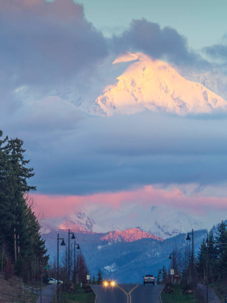 istock urban traffic at dusk,Mt.Rainier on background 939923912