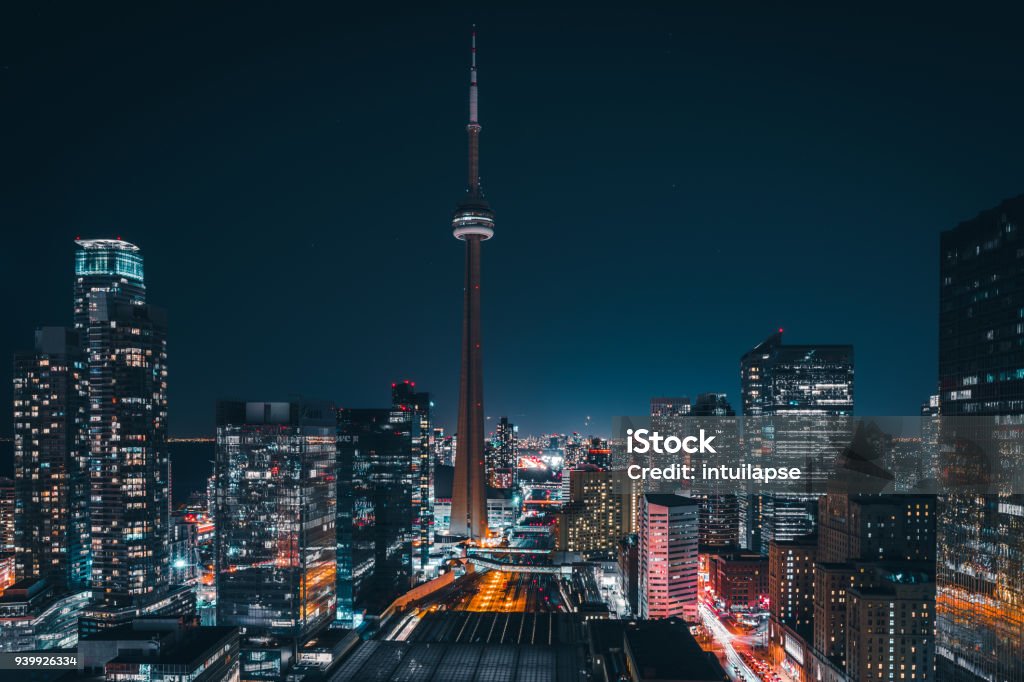 Modern Futuristic Night Toronto City Skyline Epic futuristic and modern skyline views of downtown Toronto with the train tracks leading your eye to office buildings and condominiums. Toronto Stock Photo