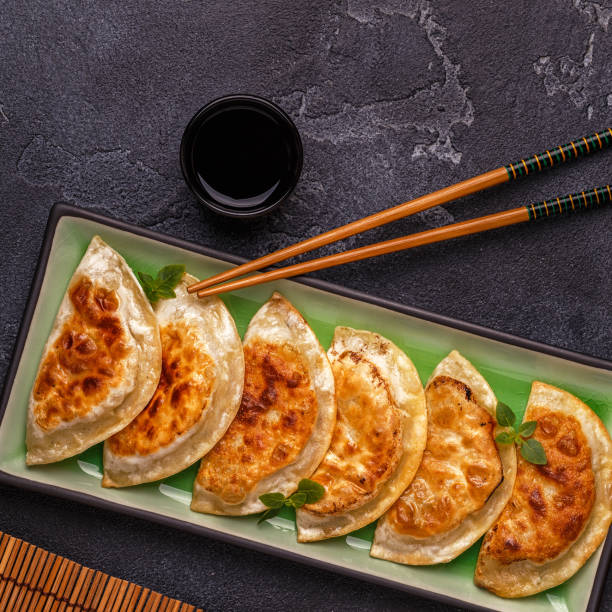 istock Plate of asian gyoza, dumplings snack 939926528