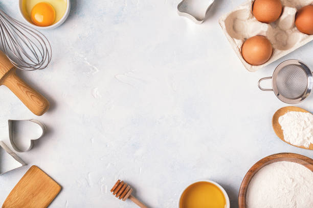 istock Ingredients for baking  - flour, wooden spoon, rolling pin, eggs. 939926624