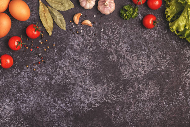 istock Ingredients for cooking on dark concrete background. 939926714