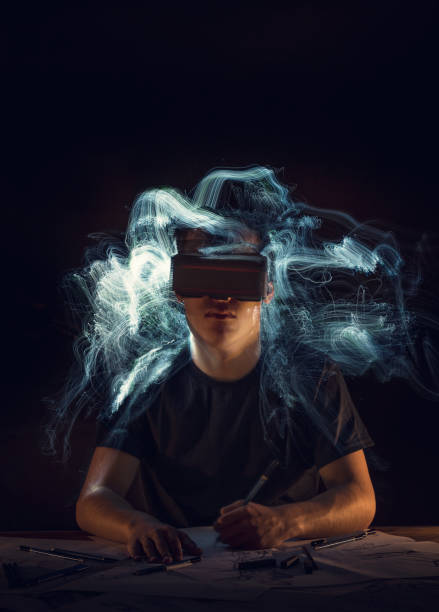 Teenager drawing with VR googles
