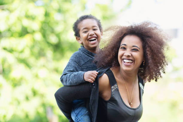 istock Happy mother with son, piggyback 939930284