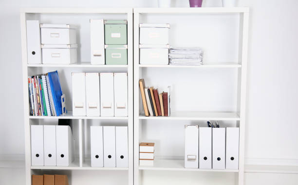 istock Modern office interior with tables, chairs and bookcases 939931550