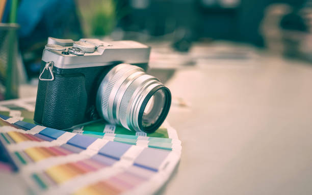 digital camera and color swatches on an office desk
