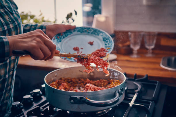 istock Preparing Homemade Spaghetti Bolognese 939934928