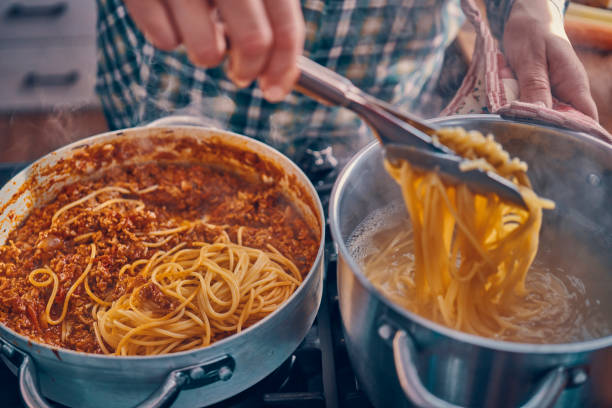 istock Preparing Homemade Spaghetti Bolognese 939935002