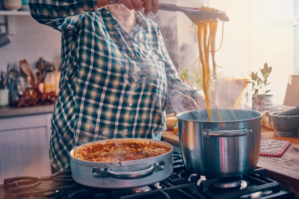 istock Preparing Homemade Spaghetti Bolognese 939935014
