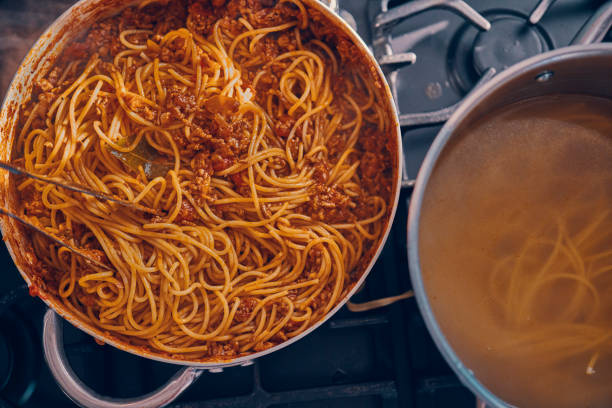 istock Preparing Homemade Spaghetti Bolognese 939935018