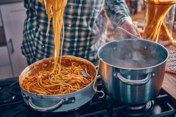 istock Preparing Homemade Spaghetti Bolognese 939935022