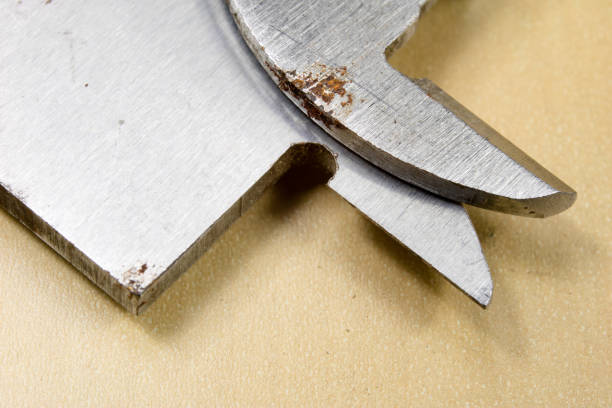 istock Measuring tools in the workshop. Caliper for locksmith work on a wooden table. Dark background. 939937296