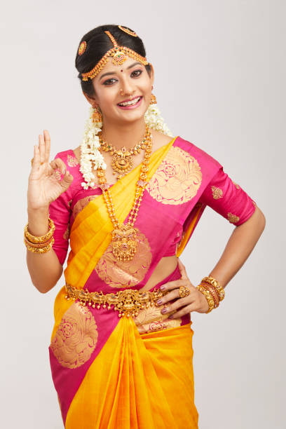 istock Beautiful smiling Indian bride posing with jewelry 939937676