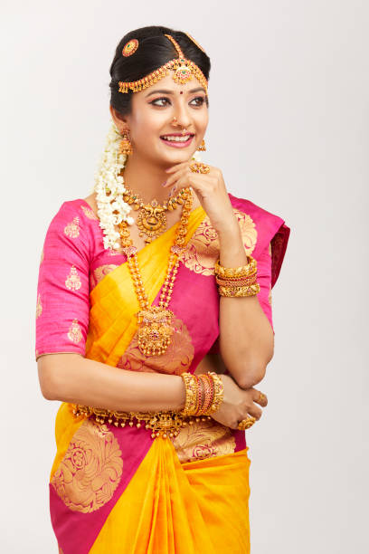 istock Beautiful smiling Indian bride posing with jewelry 939937726