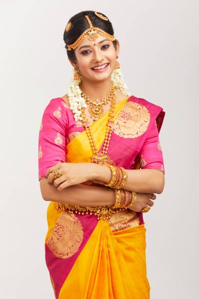 istock Beautiful smiling Indian bride posing with jewelry 939937732