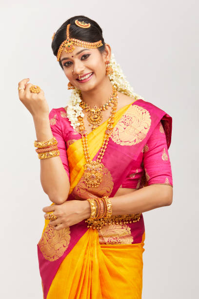 istock Beautiful smiling Indian bride posing with jewelry 939937748