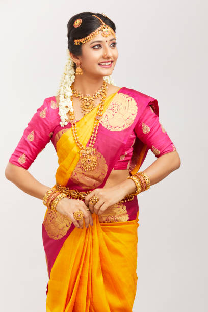 istock Beautiful smiling Indian bride posing with jewelry 939937770