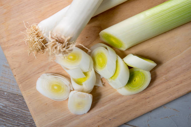 istock leeks cut into slices on a wooden plank 939939794